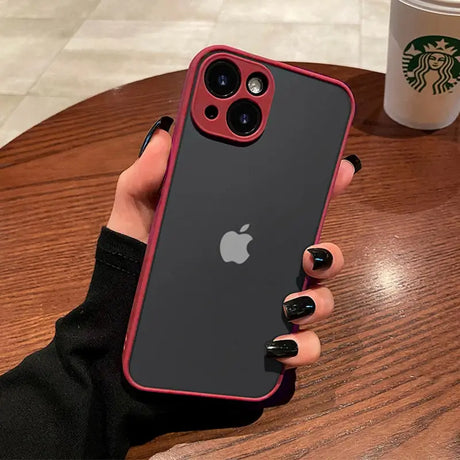 a woman holding a red iphone case