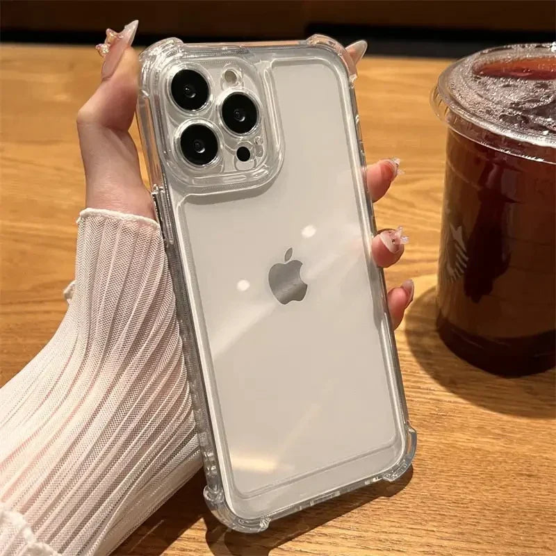 a woman holding a clear iphone case