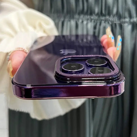 a woman holding a purple iphone in her hand