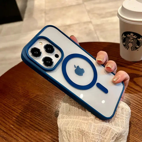 a woman holding an iphone case with a coffee cup in the background