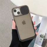 a woman holding an iphone case