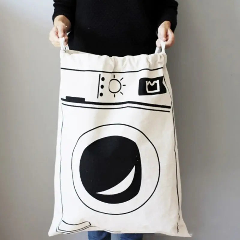 a woman holding a laundry bag with a black and white design