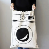 a woman holding a laundry bag with a black and white design