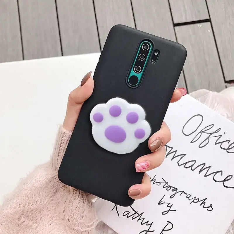 a woman holding a phone case with a purple flower on it