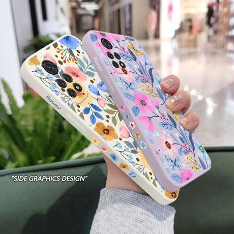 a woman holding a phone case with flowers on it