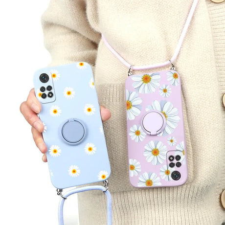 a woman holding a phone case with a flower pattern