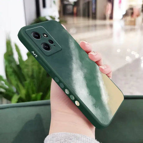 a woman holding a green phone case