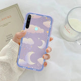 a woman holding a phone case with a purple sky and stars pattern
