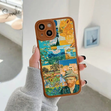 a woman holding up a phone case with a painting on it