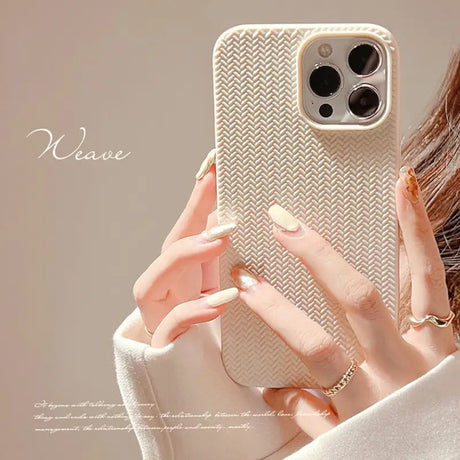 a woman holding a phone case with a white che pattern