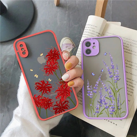 a woman holding a phone case with flowers on it