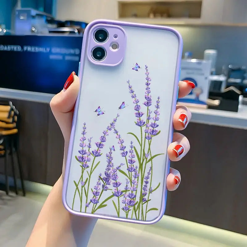 a woman holding a phone case with lavender flowers