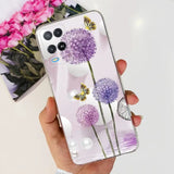 a person holding a phone case with purple flowers