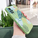 a woman holding a phone case with a floral design