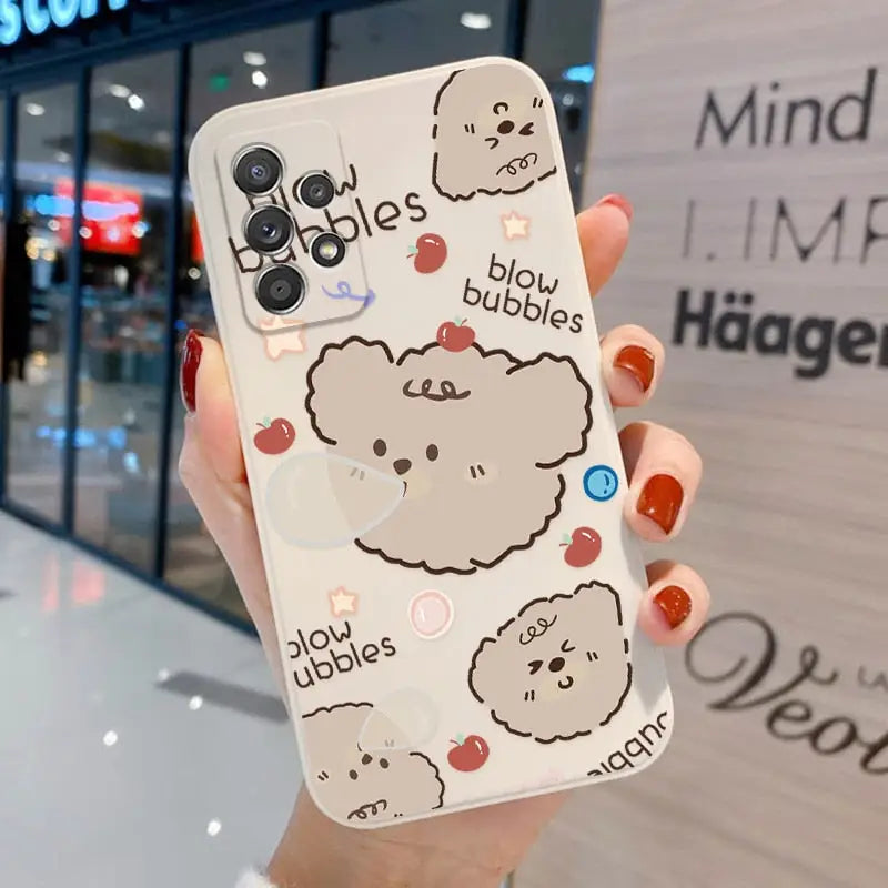 a woman holding a phone case with a drawing of a dog