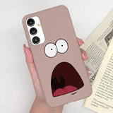 a person holding a phone case with a cartoon face