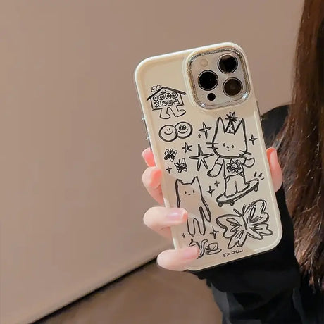 a woman holding a phone case with a drawing on it