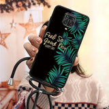 a woman holding a phone case with the text’feel your day ’