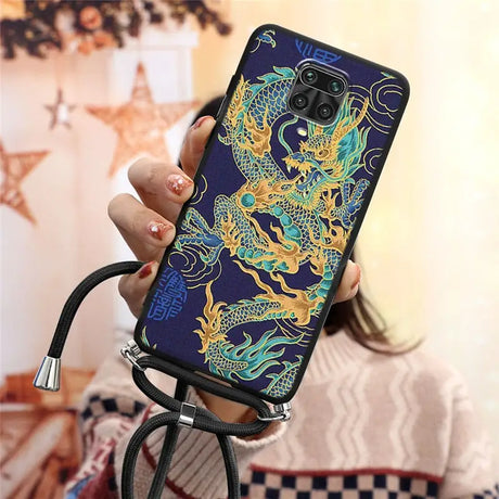 a woman holding a phone case with a dragon design