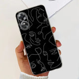 a woman holding a phone case with a black and white abstract pattern
