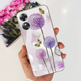 a woman holding a phone case with purple flowers
