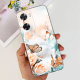 a woman holding a phone case with a butterfly and flowers on it