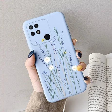 a woman holding a phone case with a flower design