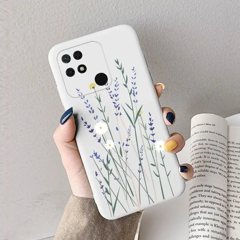 a woman holding a phone case with a watercolor painting of lavender flowers