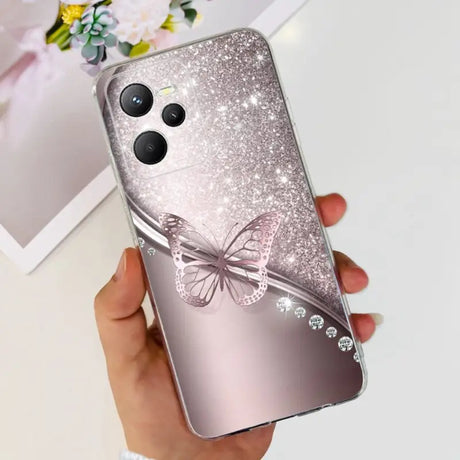 a woman holding a phone case with a butterfly on it