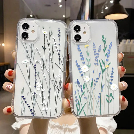 a woman holding a phone case with flowers