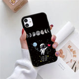a woman holding a phone case with the moon and stars on it