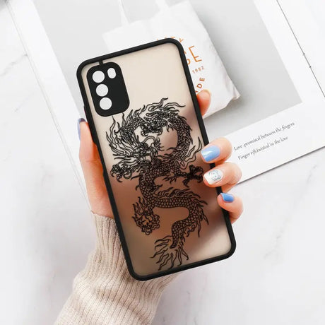 a woman holding a phone case with a dragon design