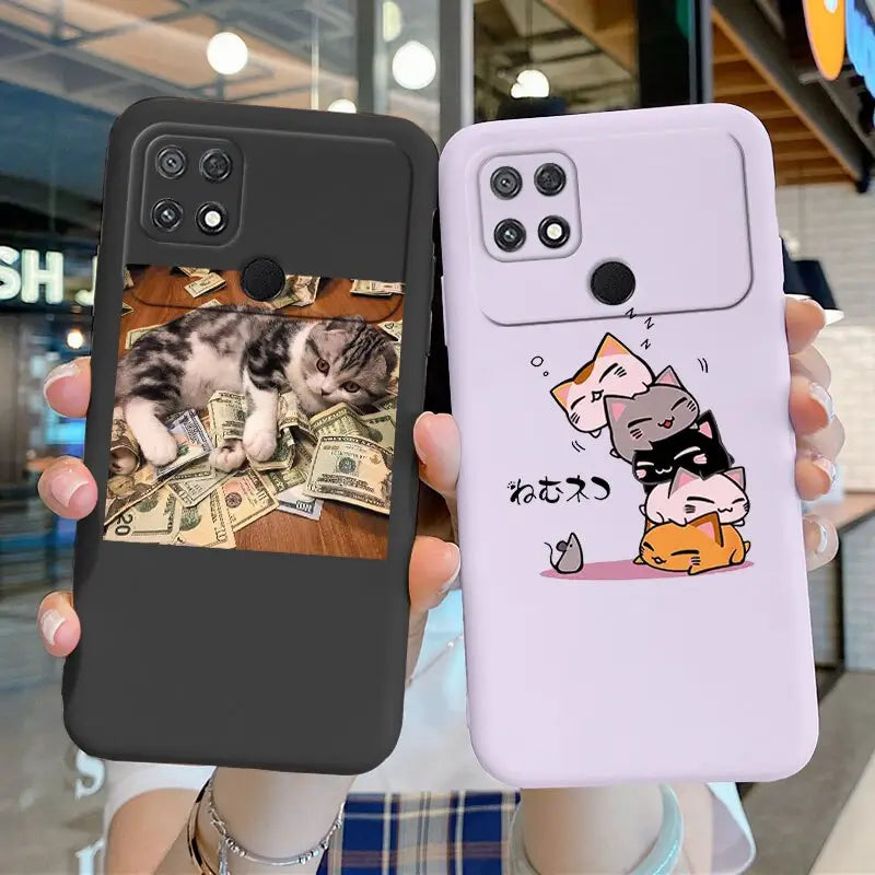 a woman holding up a phone case with a cat on it