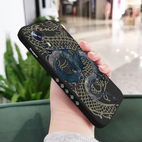 a woman holding a phone case with a dragon design