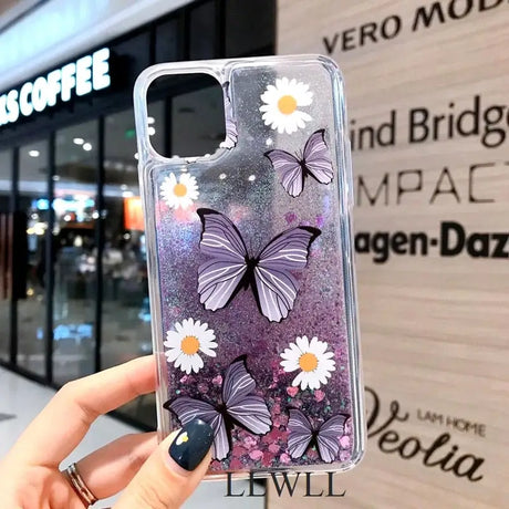 a woman holding a phone case with flowers on it