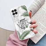 a woman holding a phone case with the words vibes on it