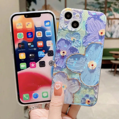 a woman holding a phone case with flowers on it