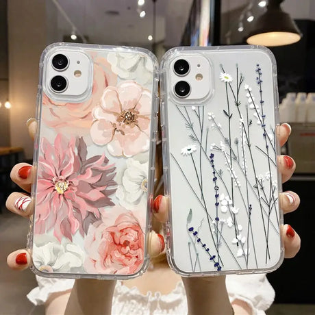 a woman holding a phone case with flowers on it