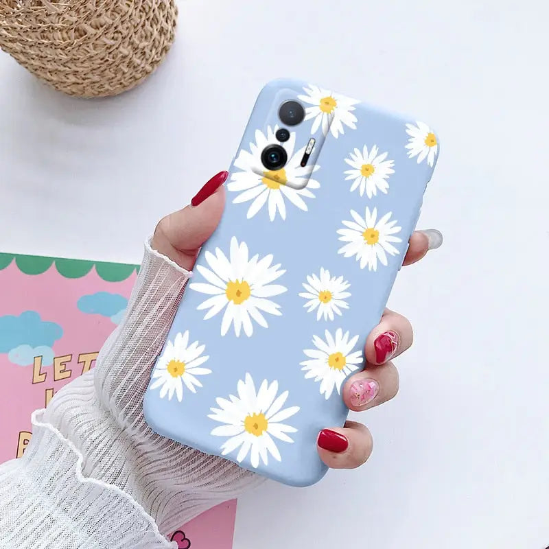 someone holding a phone with a flower pattern on it