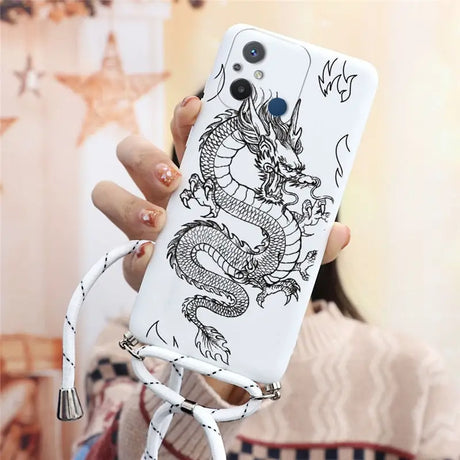 a woman holding a phone case with a dragon on it