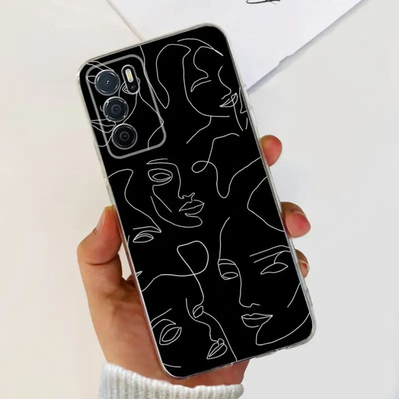 a woman holding a phone case with a black and white drawing of a woman