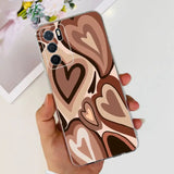 a woman holding a phone case with a heart pattern
