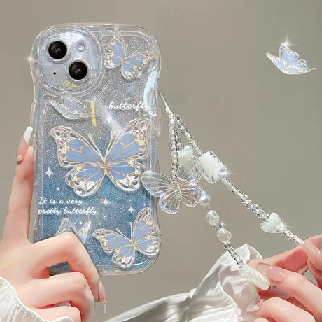 a woman holding a phone case with butterflies