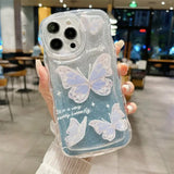 a woman holding a phone case with a white butterfly on it