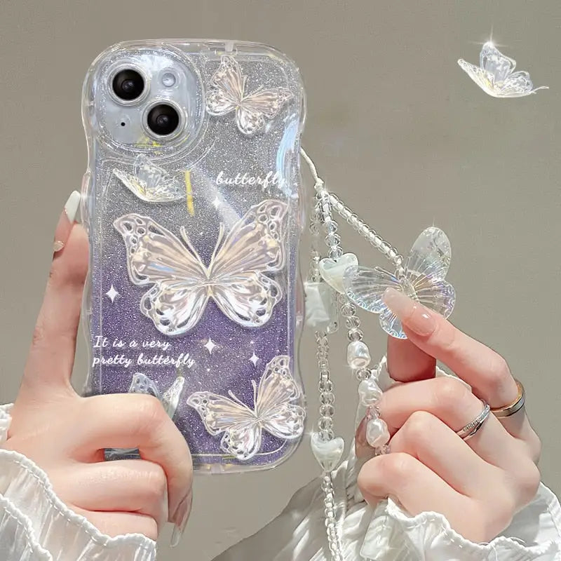 a woman holding a phone case with butterflies