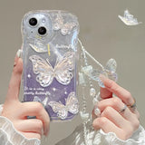 a woman holding a phone case with butterflies