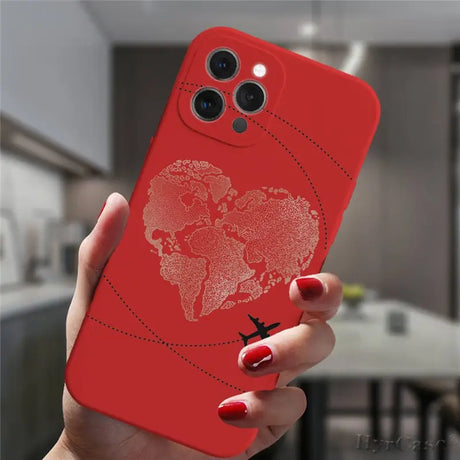 a woman holding a red phone case with a world map on it