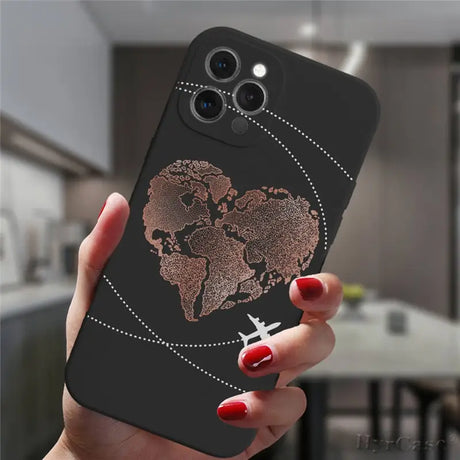 a woman holding a phone case with a world map on it