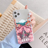 a girl holding a phone case with a pink flower