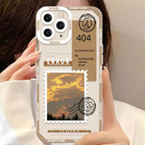 a woman holding a phone case with a picture of a sunset